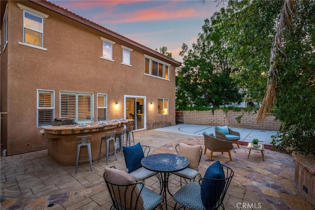 27960 Agapanthus Ln, Valencia, CA 91354 - patio terrace at dusk featuring a patio area