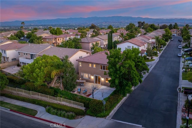 27960 Agapanthus Ln, Valencia, CA 91354 - aerial view at dusk of a residential view and a mountain view