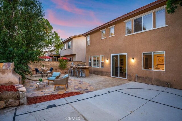 27960 Agapanthus Ln, Valencia, CA 91354 - rear view of house with stucco siding, a patio area, and a tiled roof