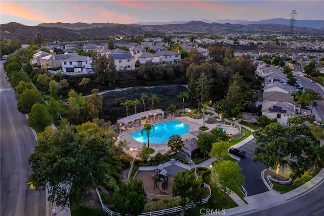 27960 Agapanthus Ln, Valencia, CA 91354 - aerial view at dusk of a mountain view, a residential view, and view of pool area