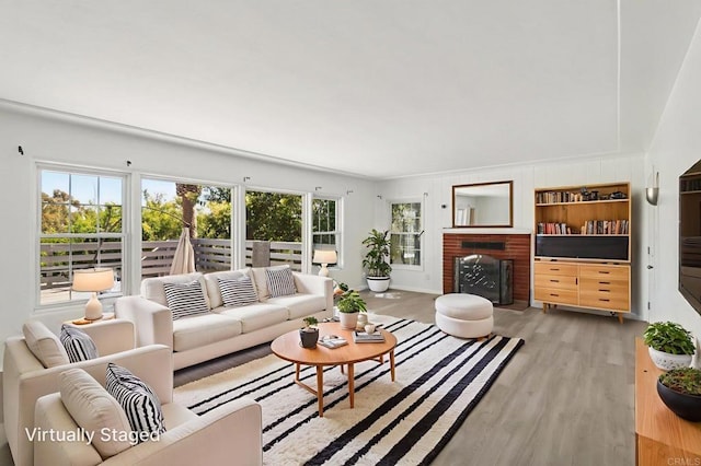 6737 San Miguel Ave, Lemon Grove, CA 91945 - living room with light wood-style flooring and a fireplace with flush hearth