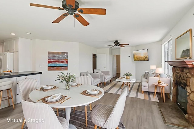 6737 San Miguel Ave, Lemon Grove, CA 91945 - dining space featuring a ceiling fan, light wood finished floors, a fireplace, and recessed lighting