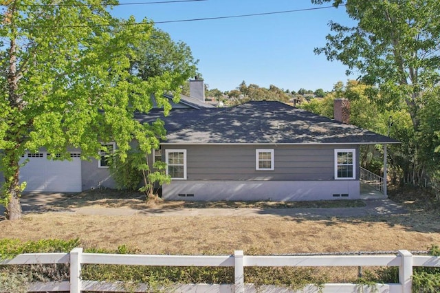 6737 San Miguel Ave, Lemon Grove, CA 91945 - back of house with a chimney, a garage, and a shingled roof