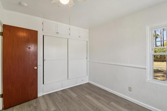 6737 San Miguel Ave, Lemon Grove, CA 91945 - unfurnished bedroom featuring wood finished floors, a closet, and a ceiling fan