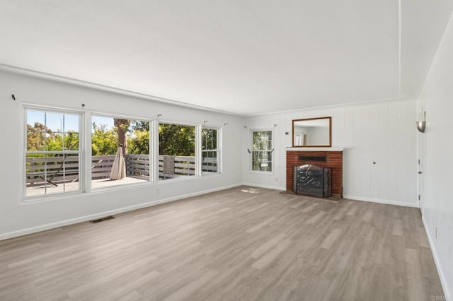 6737 San Miguel Ave, Lemon Grove, CA 91945 - unfurnished living room with wood finished floors and a fireplace