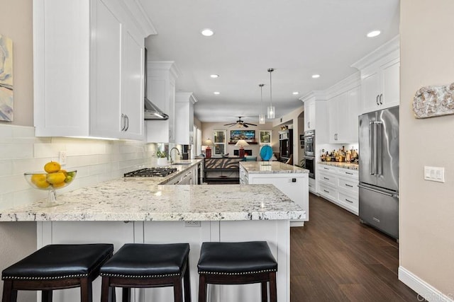 1467 Belmont Park Rd, Oceanside, CA 92057 - kitchen with appliances with stainless steel finishes, a peninsula, recessed lighting, a ceiling fan, and tasteful backsplash