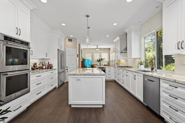 1467 Belmont Park Rd, Oceanside, CA 92057 - kitchen with appliances with stainless steel finishes, healthy amount of natural light, white cabinets, a kitchen island, and recessed lighting