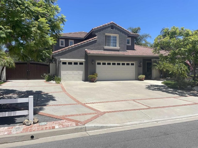 1467 Belmont Park Rd, Oceanside, CA 92057 - view of front of home featuring stucco siding, a tile roof, concrete driveway, and a gate