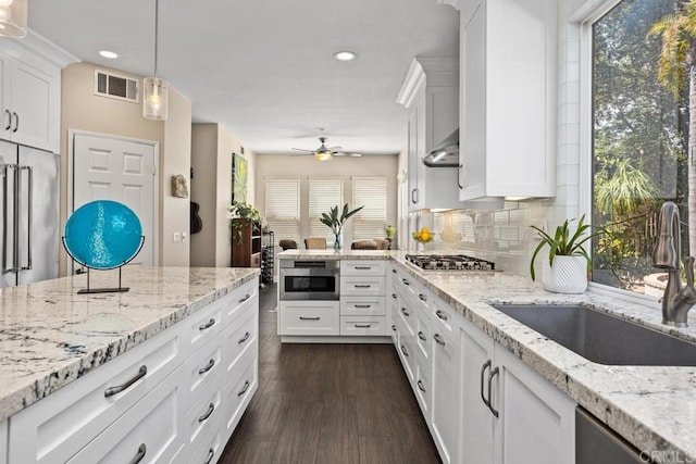 1467 Belmont Park Rd, Oceanside, CA 92057 - kitchen with stainless steel gas stovetop, white cabinets, recessed lighting, and light stone countertops