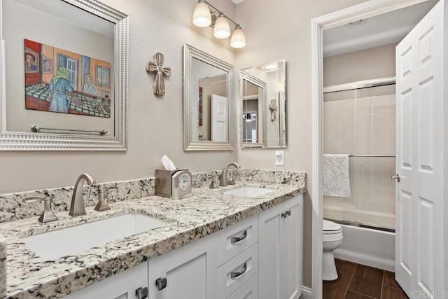 1467 Belmont Park Rd, Oceanside, CA 92057 - full bath with double vanity, combined bath / shower with glass door, and wood finished floors