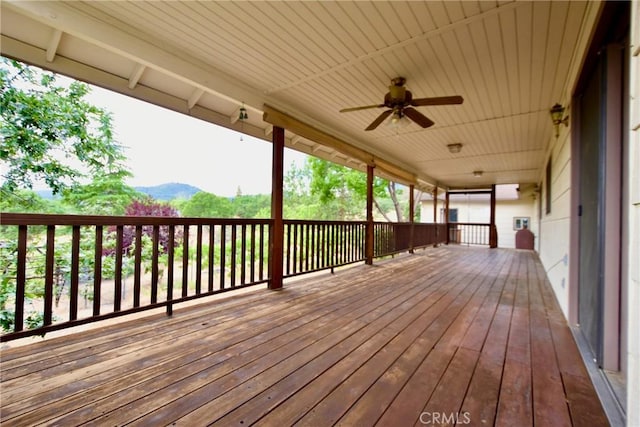 913 Northview Cir, Yreka, CA 96097 - wooden deck with a mountain view and a ceiling fan