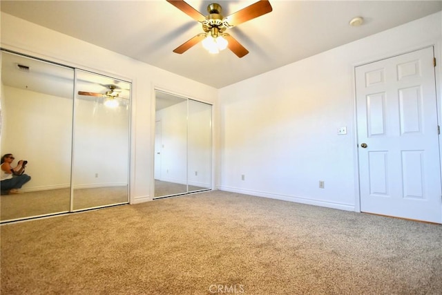 913 Northview Cir, Yreka, CA 96097 - unfurnished bedroom with two closets, carpet flooring, and ceiling fan