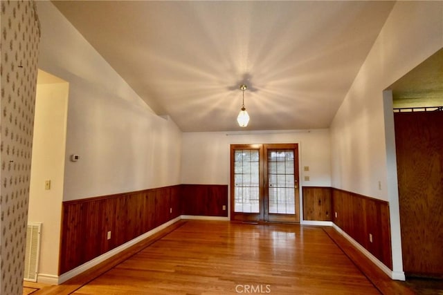913 Northview Cir, Yreka, CA 96097 - unfurnished room with wood finished floors, wainscoting, and wood walls