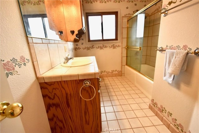913 Northview Cir, Yreka, CA 96097 - bathroom with plenty of natural light, tile patterned floors, vanity, enclosed tub / shower combo, and a textured wall