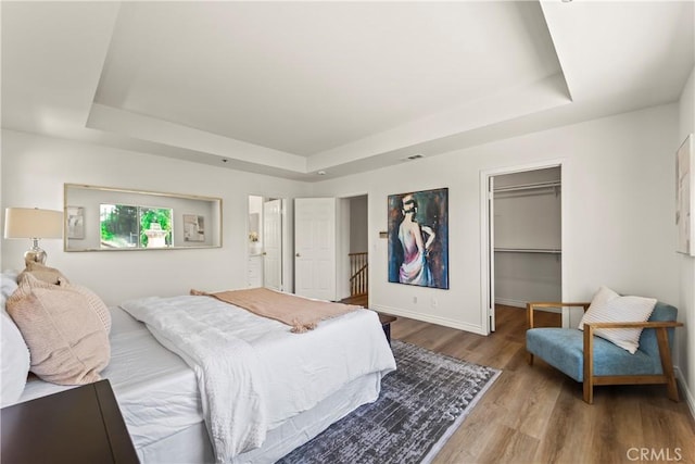 5255 La Madera Ave, El Monte, CA 91732 - bedroom featuring a tray ceiling, wood finished floors, a spacious closet, and a closet