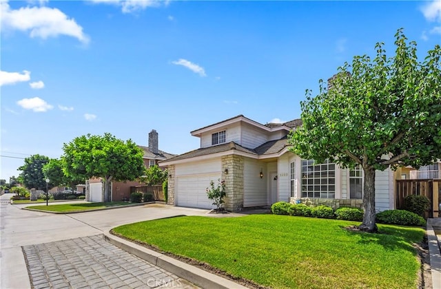 5255 La Madera Ave, El Monte, CA 91732 - view of front facade featuring stone siding, driveway, and a garage