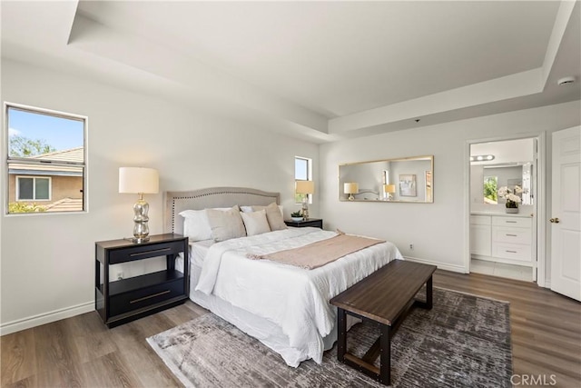 5255 La Madera Ave, El Monte, CA 91732 - bedroom featuring a tray ceiling, wood finished floors, and connected bathroom