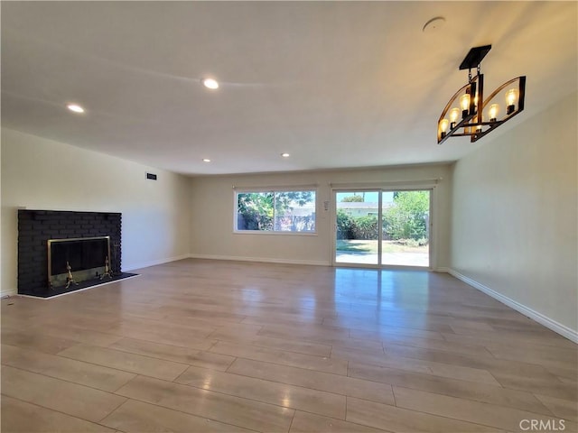 17623 Clymer St, Granada Hills, CA 91344 - unfurnished living room with recessed lighting, wood finished floors, a fireplace, and a chandelier
