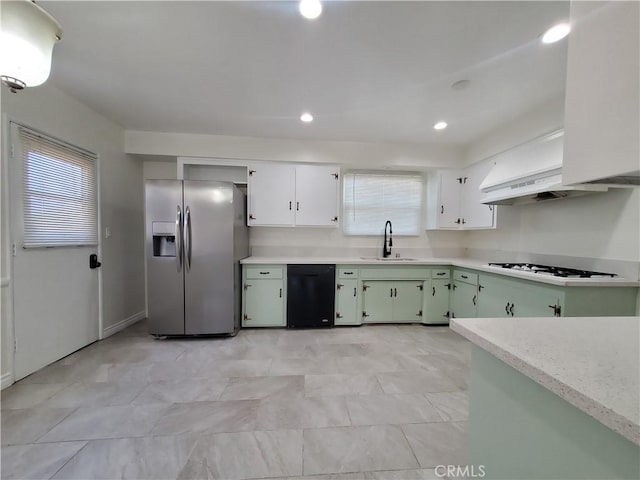 17623 Clymer St, Granada Hills, CA 91344 - kitchen with stainless steel fridge, white cooktop, black dishwasher, light countertops, and recessed lighting