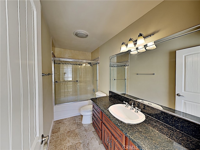 2030 Kingsbridge Way, Oxnard, CA 93035 - bathroom featuring vanity, combined bath / shower with glass door, and stone tile flooring