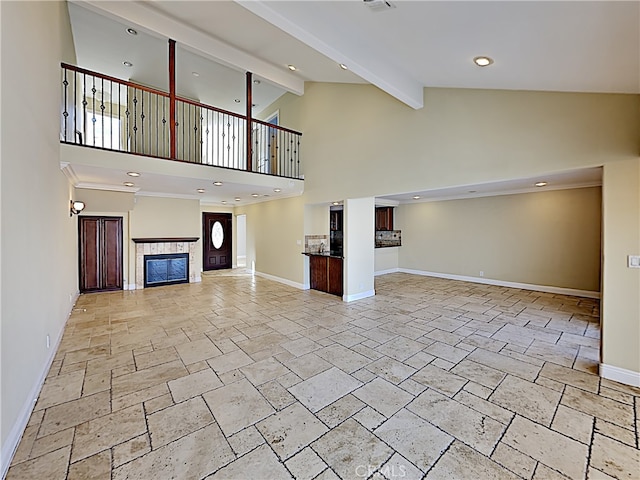 2030 Kingsbridge Way, Oxnard, CA 93035 - unfurnished living room featuring stone tile flooring, high vaulted ceiling, a fireplace, beam ceiling, and recessed lighting