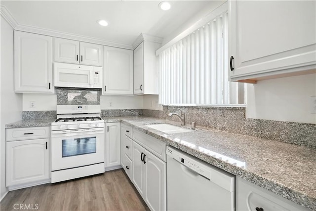 25796 Olivas Park Rd, Valencia, CA 91355 - kitchen featuring white appliances, white cabinets, light wood-style flooring, light stone countertops, and recessed lighting