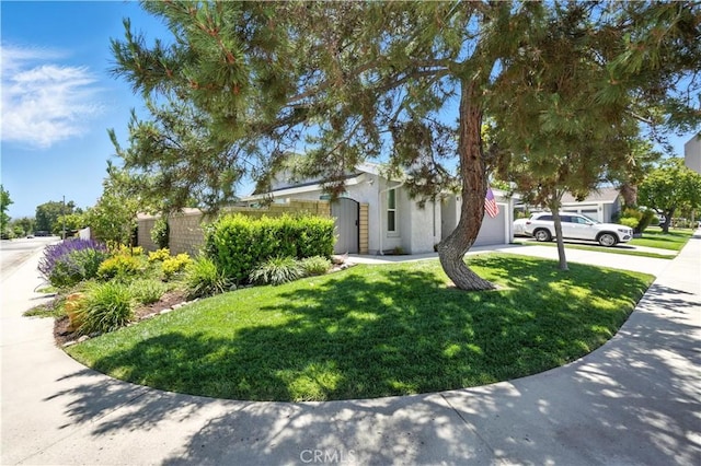 25796 Olivas Park Rd, Valencia, CA 91355 - view of side of home with an attached garage, concrete driveway, and stucco siding