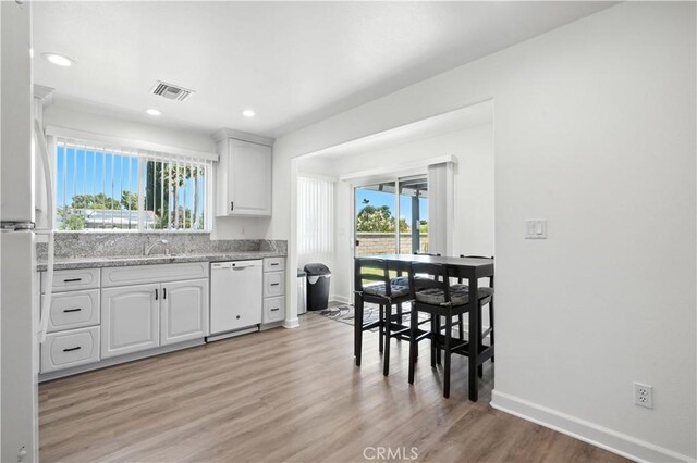 25796 Olivas Park Rd, Valencia, CA 91355 - kitchen with white appliances, healthy amount of natural light, white cabinetry, and recessed lighting
