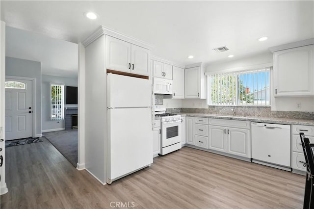 25796 Olivas Park Rd, Valencia, CA 91355 - kitchen with white appliances, light wood-style floors, healthy amount of natural light, white cabinetry, and recessed lighting