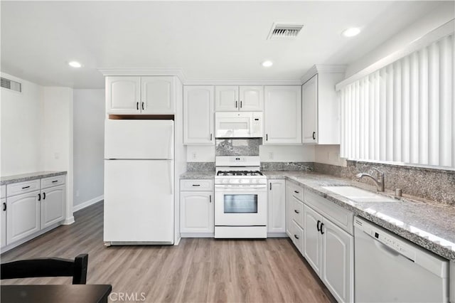 25796 Olivas Park Rd, Valencia, CA 91355 - kitchen with white appliances, white cabinetry, light wood finished floors, light stone counters, and recessed lighting