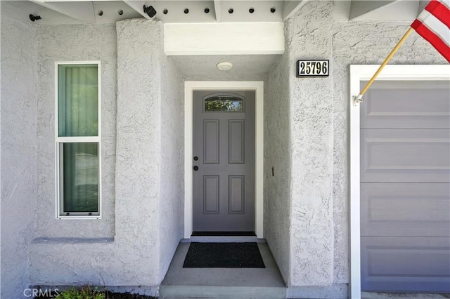 25796 Olivas Park Rd, Valencia, CA 91355 - doorway to property with stucco siding