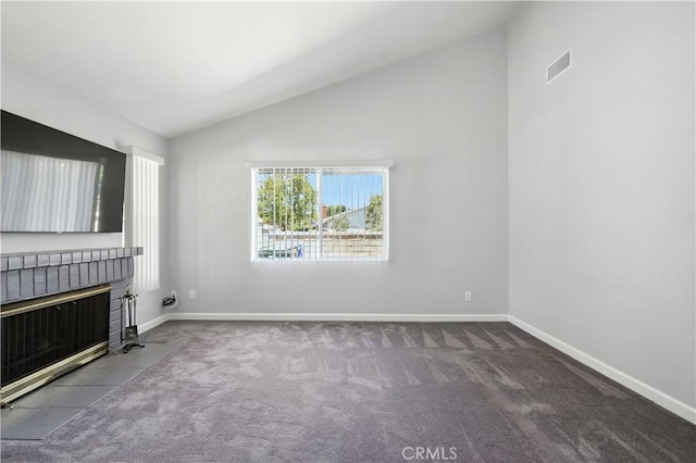 25796 Olivas Park Rd, Valencia, CA 91355 - unfurnished living room featuring lofted ceiling, a tile fireplace, and carpet