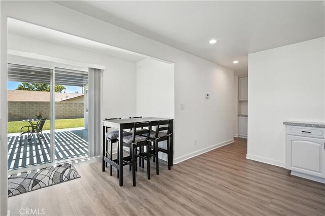 25796 Olivas Park Rd, Valencia, CA 91355 - dining space featuring light wood-style floors and recessed lighting