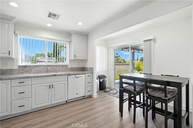 25796 Olivas Park Rd, Valencia, CA 91355 - kitchen featuring white dishwasher, white cabinets, light wood-style floors, light countertops, and recessed lighting