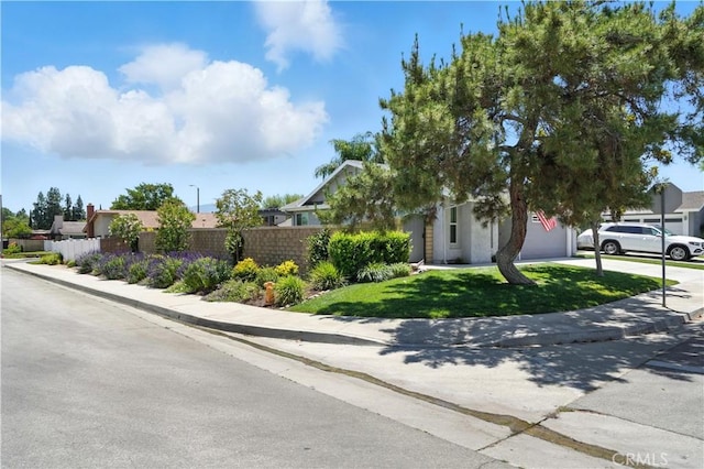 25796 Olivas Park Rd, Valencia, CA 91355 - obstructed view of property featuring an attached garage and driveway