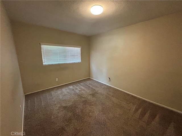 810 E Silva St, Long Beach, CA 90807 - carpeted empty room with baseboards and a textured ceiling