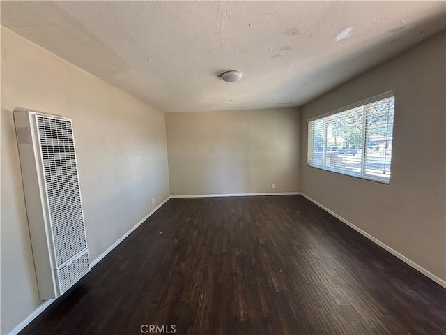 810 E Silva St, Long Beach, CA 90807 - spare room with a heating unit and dark wood finished floors