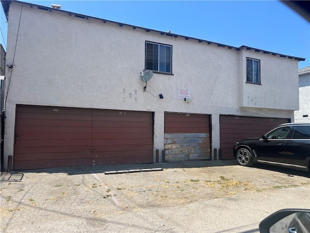 7018 La Tijera Blvd, Los Angeles, CA 90045 - view of front of home featuring an attached garage and stucco siding