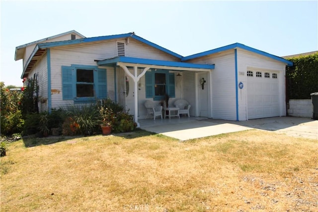 20512 Berendo Ave, Torrance, CA 90502 - view of front of property with an attached garage, a porch, driveway, and a front yard
