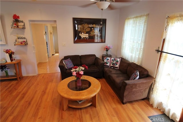 20512 Berendo Ave, Torrance, CA 90502 - living area with light wood finished floors, healthy amount of natural light, and a ceiling fan