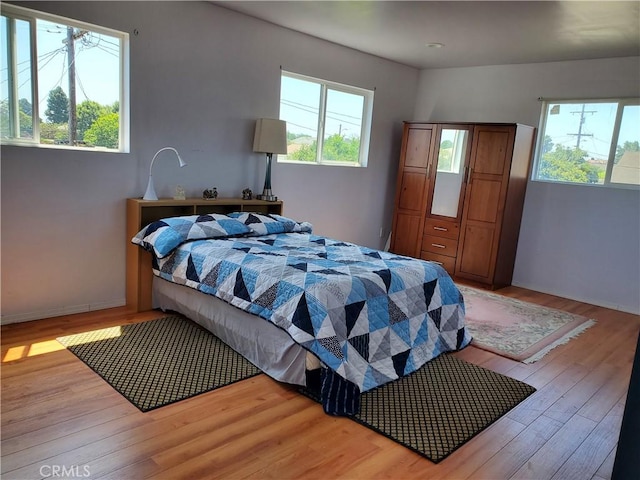 20512 Berendo Ave, Torrance, CA 90502 - bedroom featuring wood finished floors and multiple windows