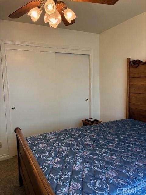 32079 Fern Dr, Running Springs, CA 92382 - carpeted bedroom with a ceiling fan and a closet