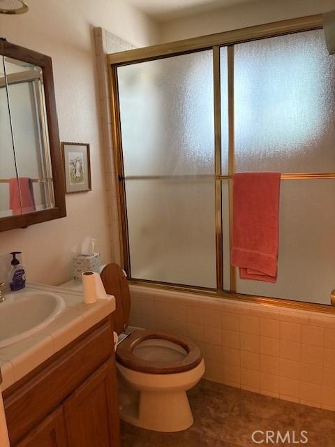 32079 Fern Dr, Running Springs, CA 92382 - bathroom featuring vanity, shower / bath combination with glass door, and tile patterned floors