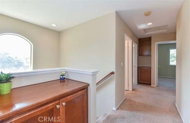 1063 S Reservoir St, Pomona, CA 91766 - corridor featuring light colored carpet, attic access, recessed lighting, and an upstairs landing