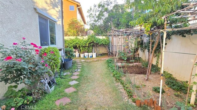 1063 S Reservoir St, Pomona, CA 91766 - fenced backyard with a garden