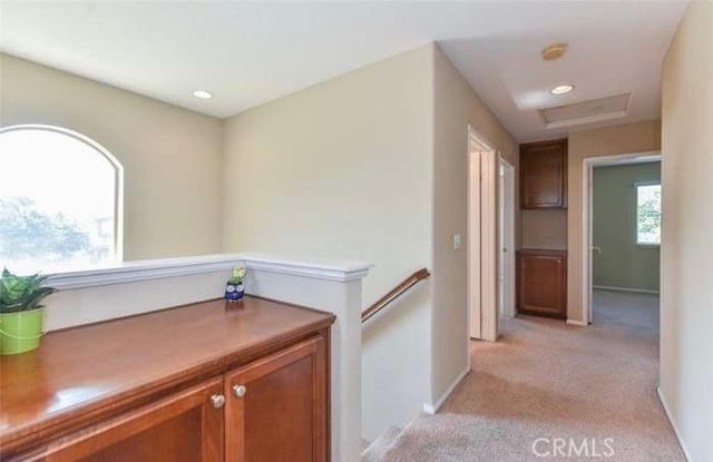 1063 S Reservoir St, Pomona, CA 91766 - hallway featuring light carpet, attic access, recessed lighting, and an upstairs landing