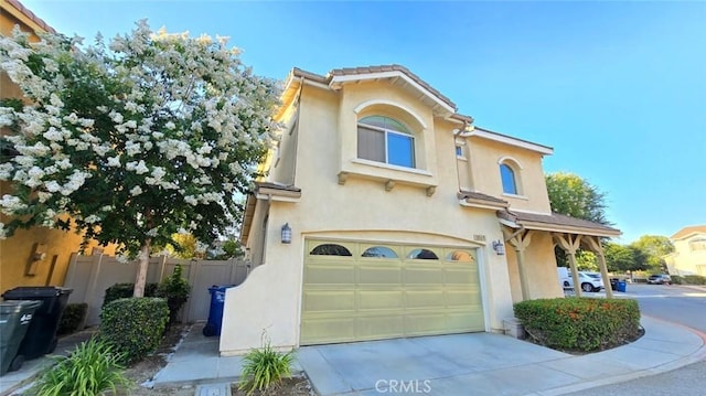 1063 S Reservoir St, Pomona, CA 91766 - mediterranean / spanish home with a garage, stucco siding, and concrete driveway
