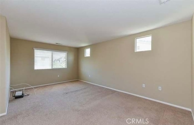 1063 S Reservoir St, Pomona, CA 91766 - empty room with plenty of natural light and carpet floors