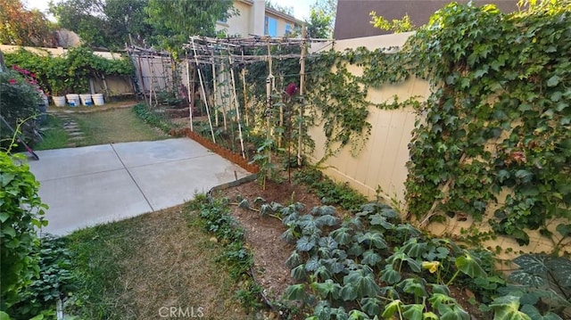 1063 S Reservoir St, Pomona, CA 91766 - fenced backyard with a patio area