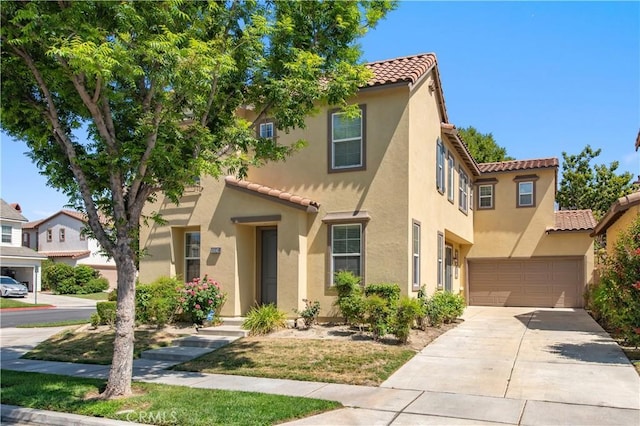 10324 Bold Red Dr, Rancho Cucamonga, CA 91730 - mediterranean / spanish-style home with a tile roof, driveway, stucco siding, and an attached garage